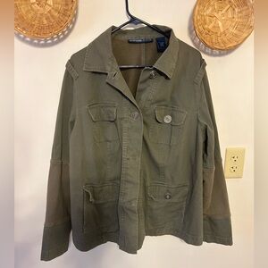 Green jean jacket with cotton patches on the arms and on the back